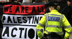 A demonstration with a banner reading "We are all Palestine Action"