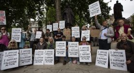 People protesting the banning of Palestine Action in Parliament Square