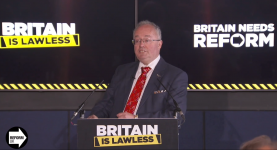 Rupert Matthews speaking at a Reform UK press conference